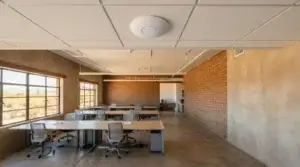 Ceiling-mounted Wi-Fi access point in an office with masonry walls